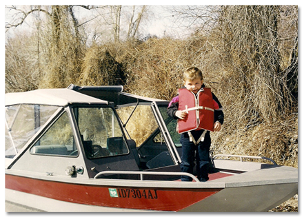 Photo of Brock on Grandpa Scott's boat