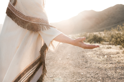 Photo of Jesus holding out his hand.